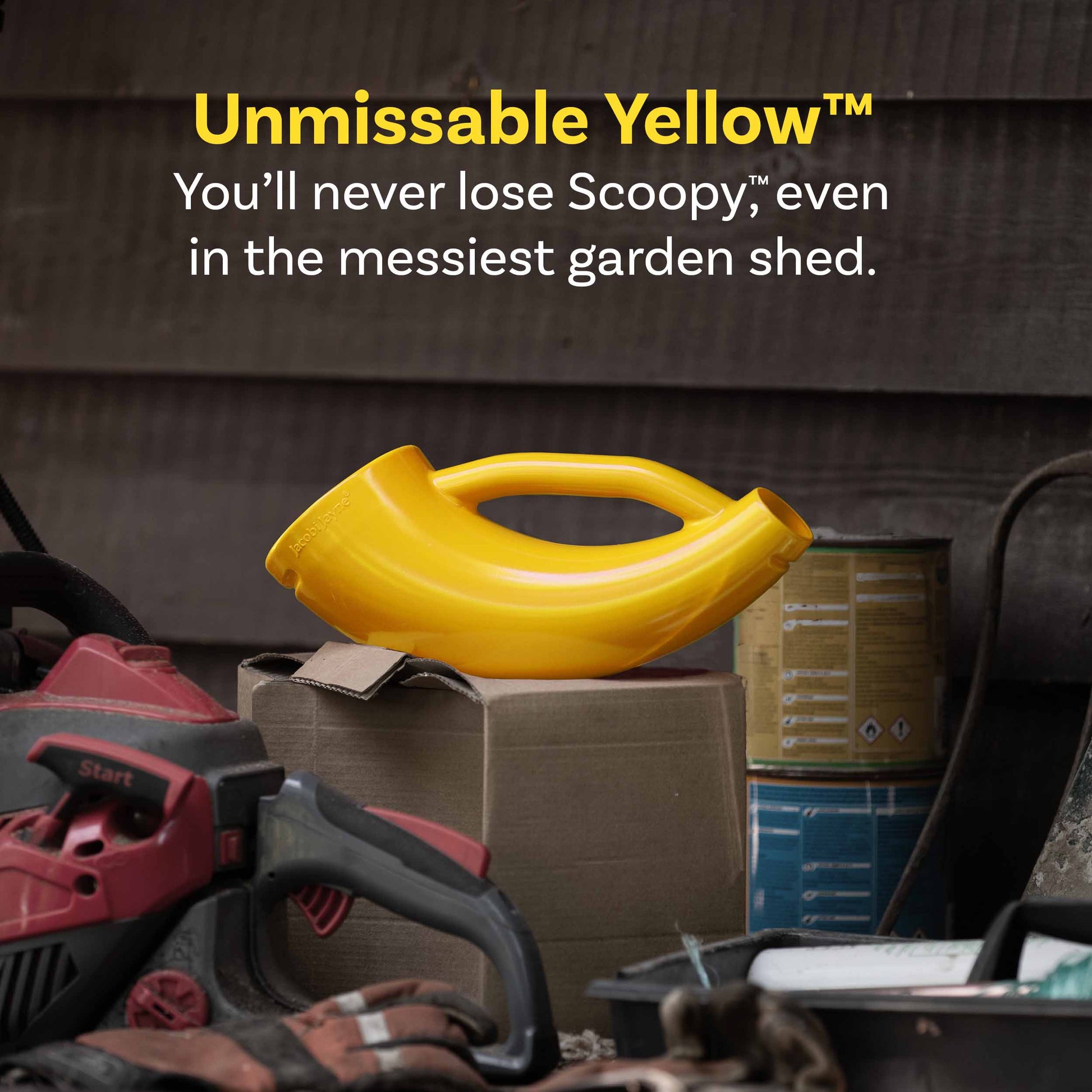 Yellow Scoopy in a messy garden shed surrounded by messy yard tools, showcasing how unmissable it is.