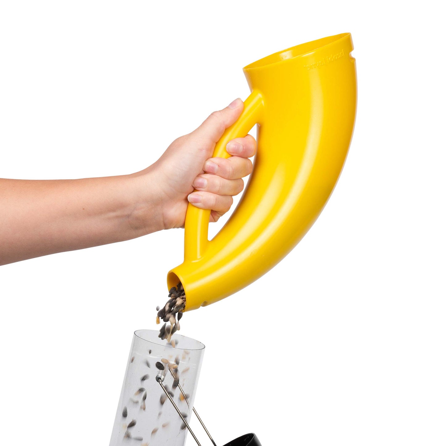 Hand pouring bird seed into a large easy clean bird feeder with Scoopy yellow bird food scoop.
