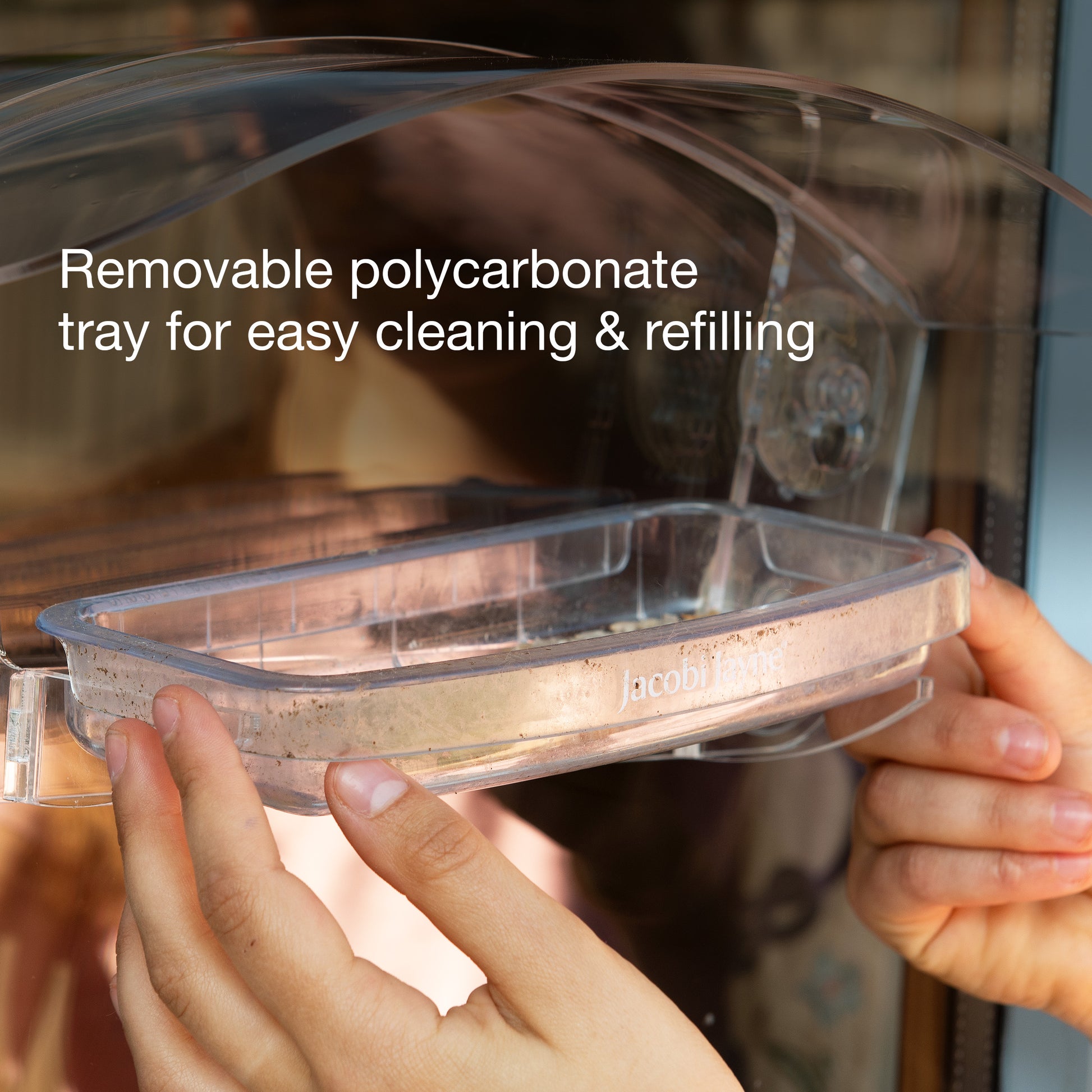 Removable polycarbonate tray for easy cleaning and refilling. 